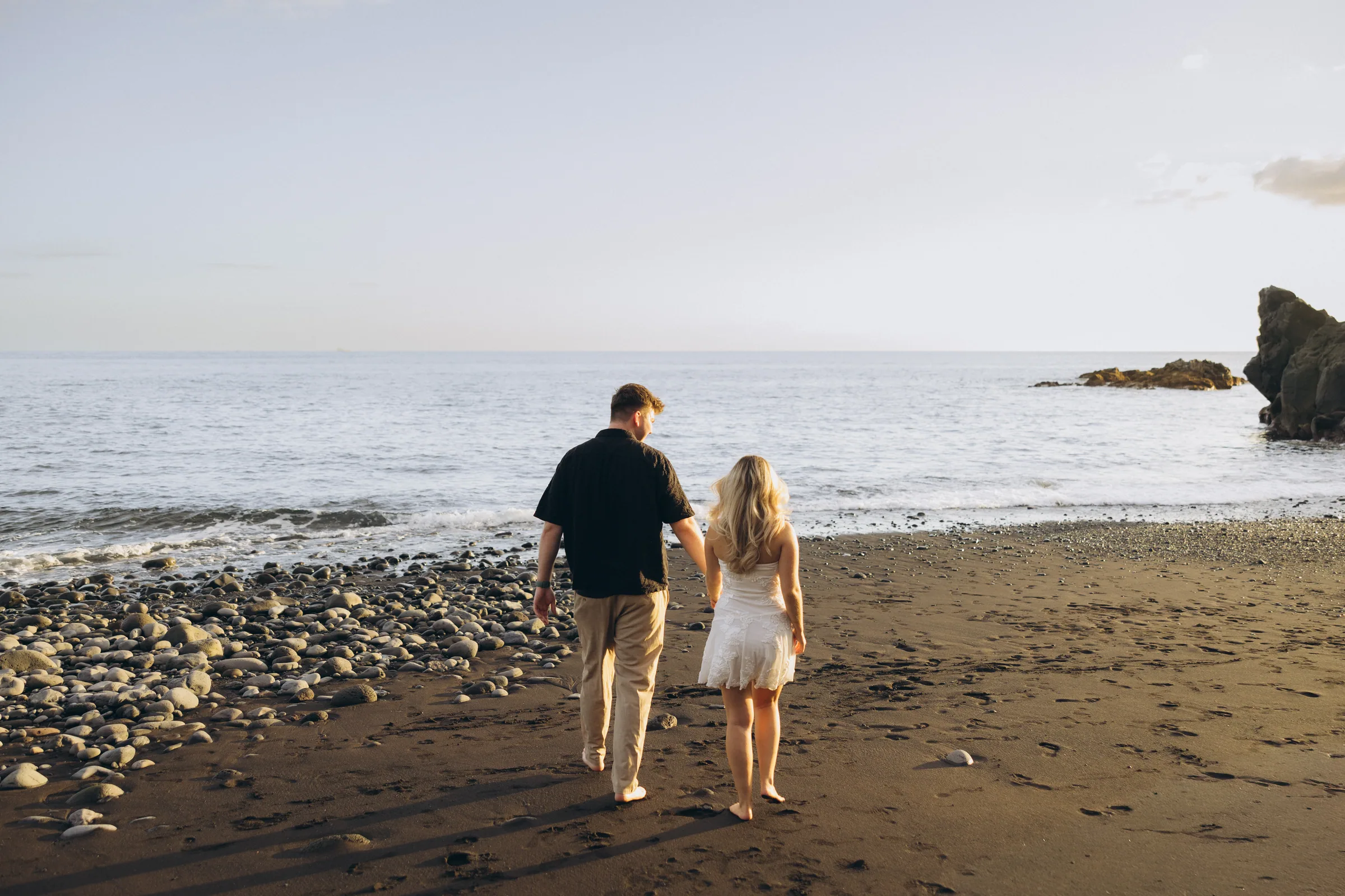 Running along the shoreline at sunset